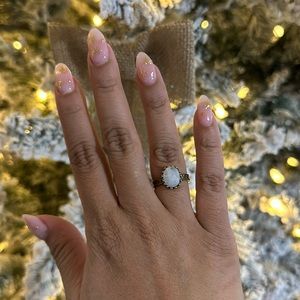 Sterling silver, gold-filled ring with a large moonstone centerpiece.